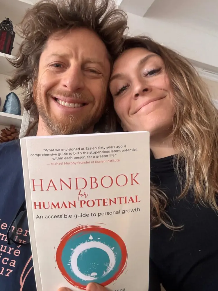 Reader holding Handbook for Human Potential — reader photo 3