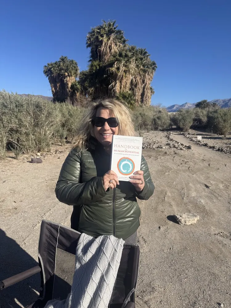 Reader holding Handbook for Human Potential — reader photo 5
